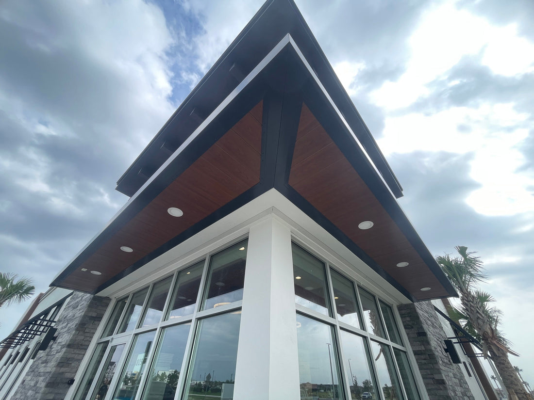 Woodgrain aluminum canopy soffit on a commercial entrance