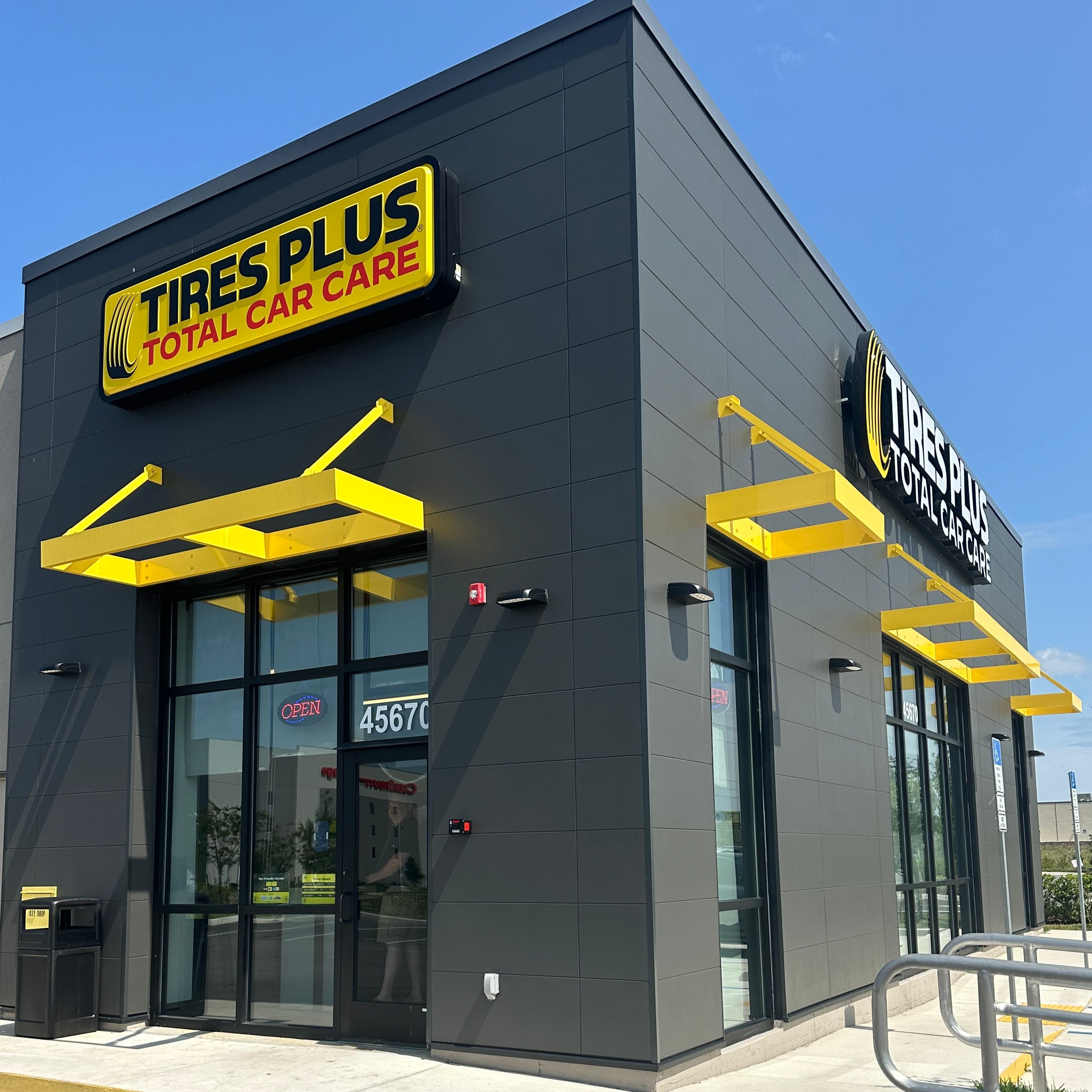 Commercial aluminum window awnings on a storefront by 1800Awnings