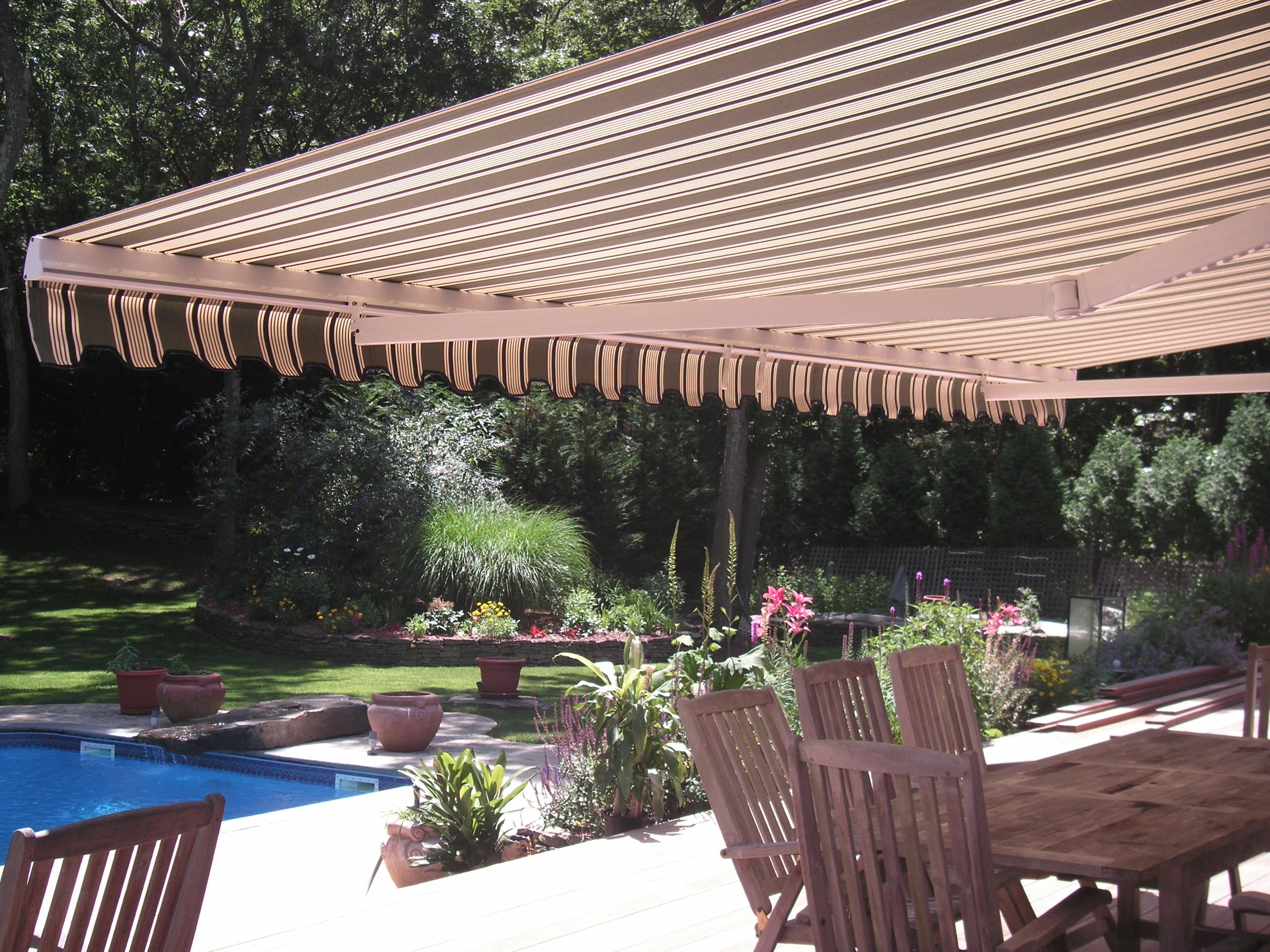 Shademaker Zeus motorized patio awning providing shade